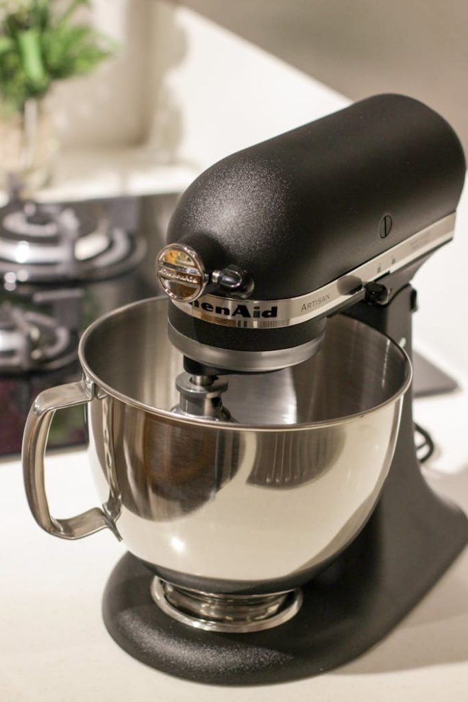 pexels photo 1450907 A stylish black kitchen mixer in a modern kitchen setting, perfect for baking needs.